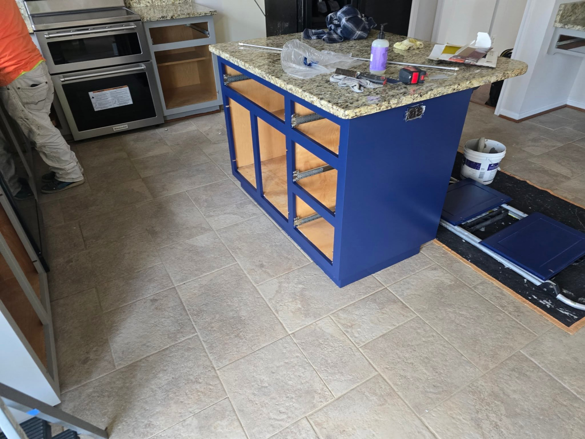 Kitchen island cabinetry during painting
