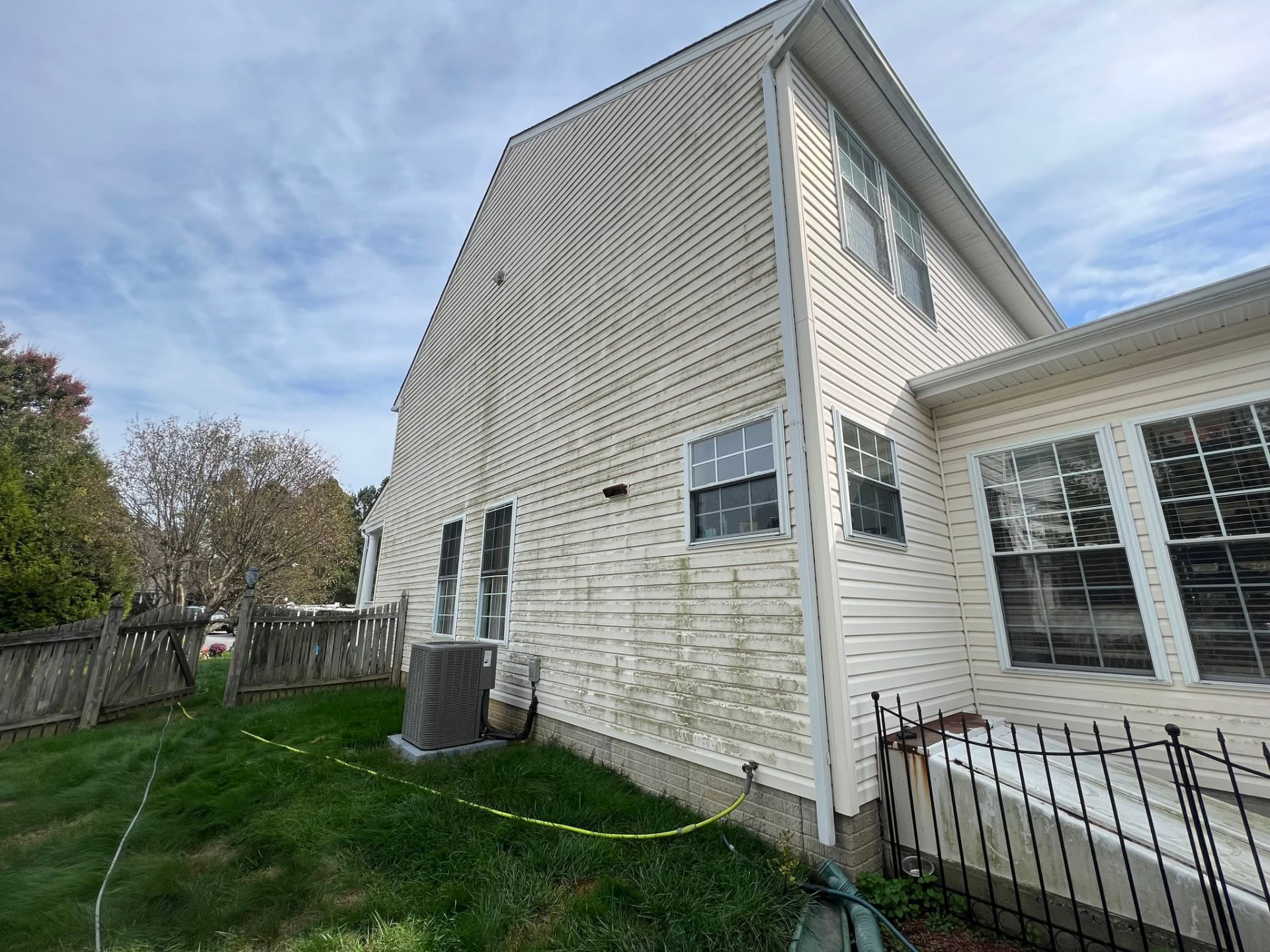 House siding prepared for cleaning